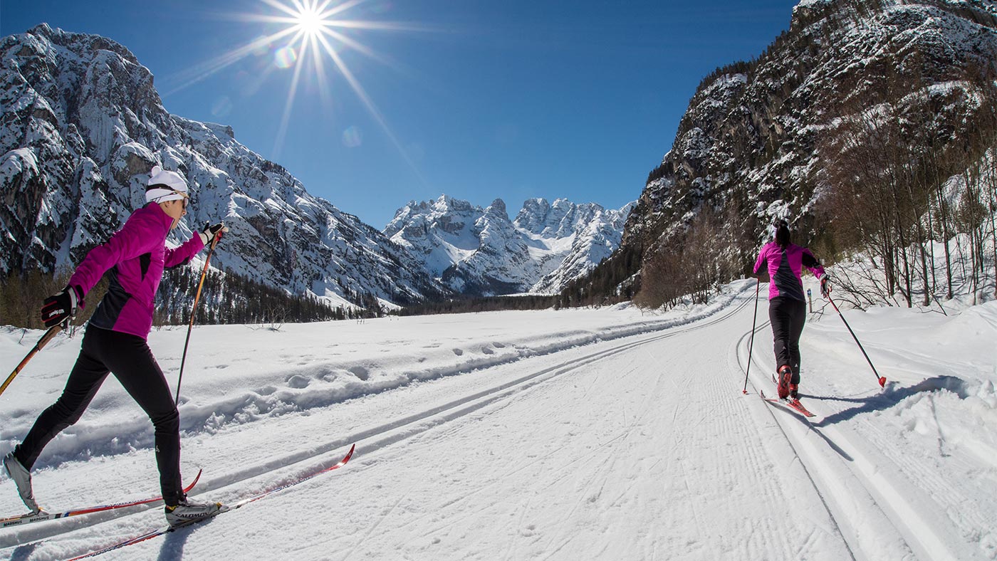 Two ladies on the cross-country ski trail in San Candido in winter
