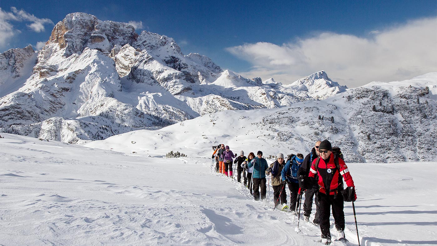 A group during a snow hike in the mountains